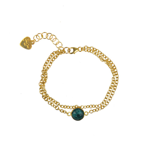 Gena Myints Emerald Vermeil Double Chain Bracelet features a central green stone and a heart-shaped charm.