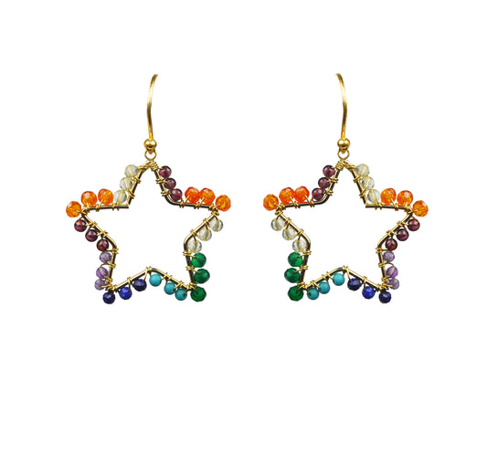 The Chakra Star Vermeil Earrings by Gena Myint feature a gold wire frame in a star shape, adorned with multicolored beads—orange, green, blue, and purple—on a white background.