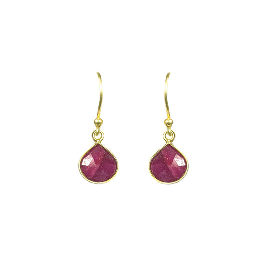 Gena Myints Ruby Bezel Drop Earrings feature gold hook settings with teardrop-shaped pink stones.