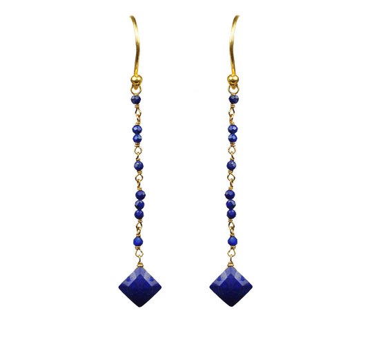 Gena Myints Lapis Lazuli Linear Vermeil Earrings feature gold wire with dangling blue beads and square blue gemstones.