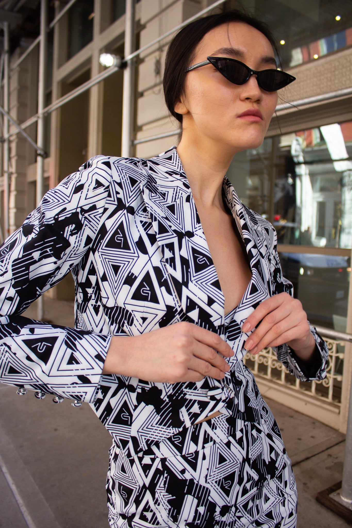 Le Réussi® Amour Geometric Blazer featuring a black and white geometric pattern on a white background.