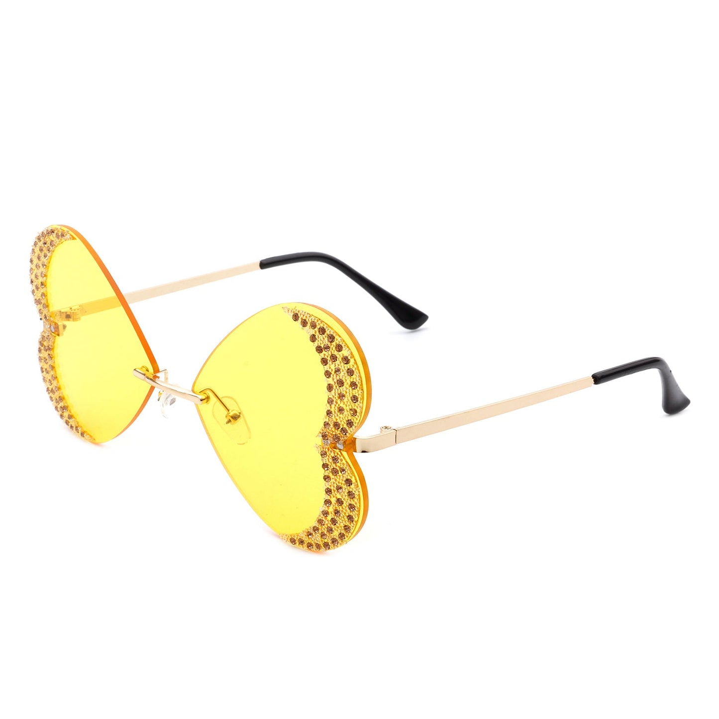 The Quixotia - Rimless Butterfly Heart Shape Tinted Fashion Women Sunglasses by Cramilo Eyewear are heart-shaped with purple lenses and golden arms, adorned with rhinestones along the edges.