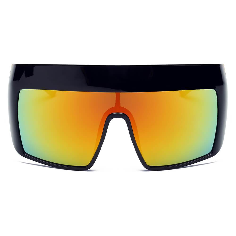 Peach-colored FOLSOM Oversize Shield Sunglasses by Cramilo Eyewear, featuring a frameless visor style with reflective rainbow-tinted lenses, displayed on a white background.