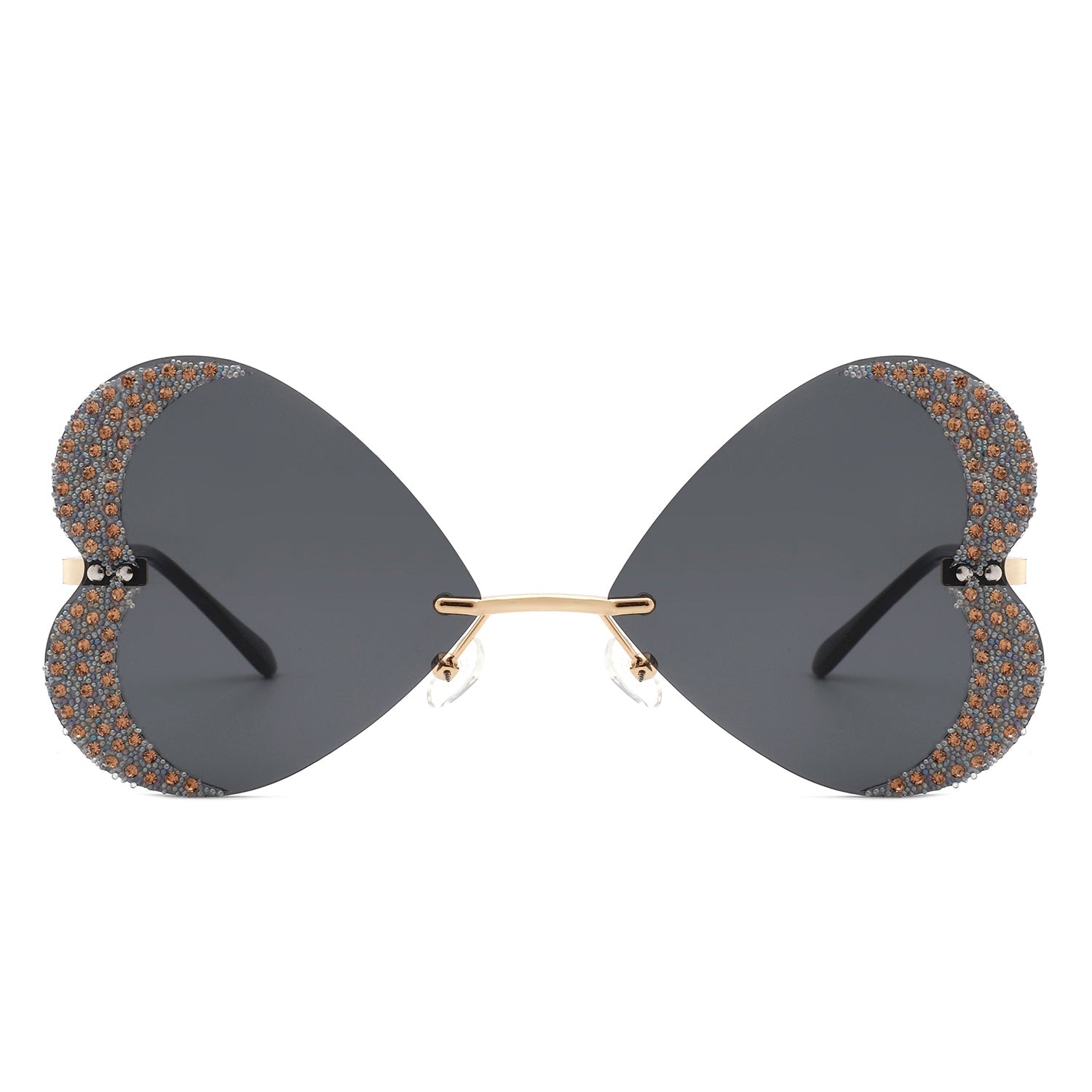 The Quixotia - Rimless Butterfly Heart Shape Tinted Fashion Women Sunglasses by Cramilo Eyewear are heart-shaped with purple lenses and golden arms, adorned with rhinestones along the edges.