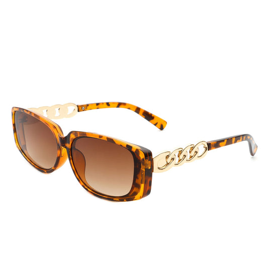 Helixian by Cramilo Eyewear: Chic tortoise-shell rectangle sunglasses for women, featuring chain-link gold accents and brown gradient lenses.