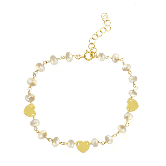 Gena Myints Pearl and Heart Charm Bracelet: A gold bracelet featuring pearl beads and three heart-shaped charms.