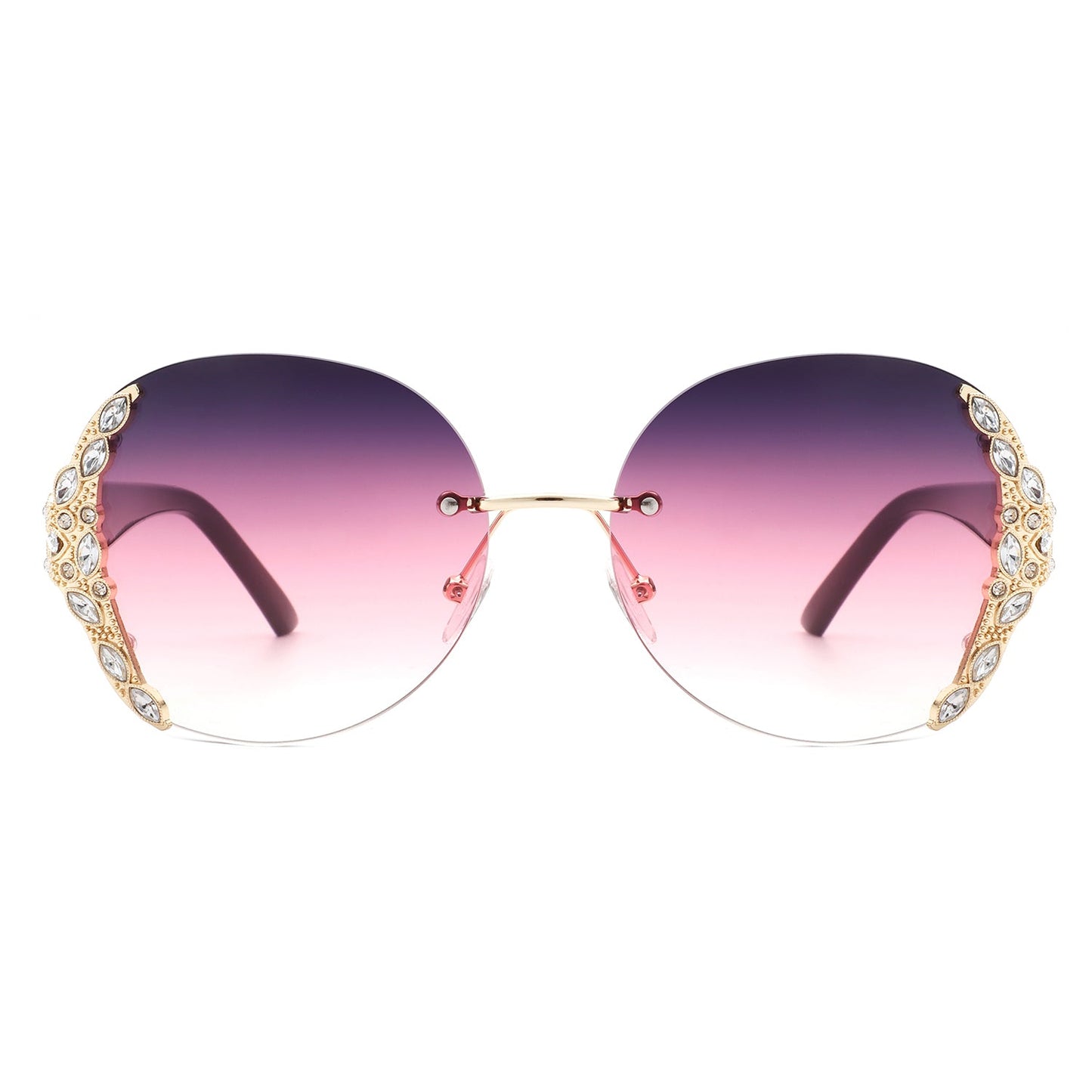 Stylish black sunglasses with oval rimless frames, pink gradient lenses, ornate gold detailing, and rhinestone design by Cramilo Eyewear.