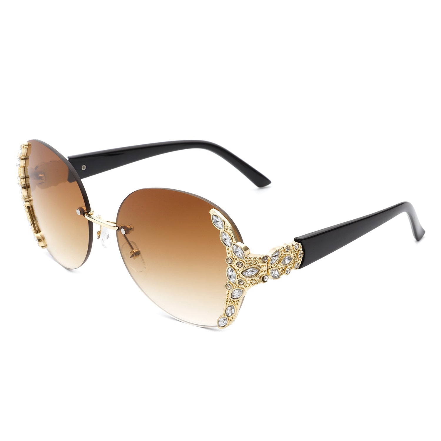 Stylish black sunglasses with oval rimless frames, pink gradient lenses, ornate gold detailing, and rhinestone design by Cramilo Eyewear.