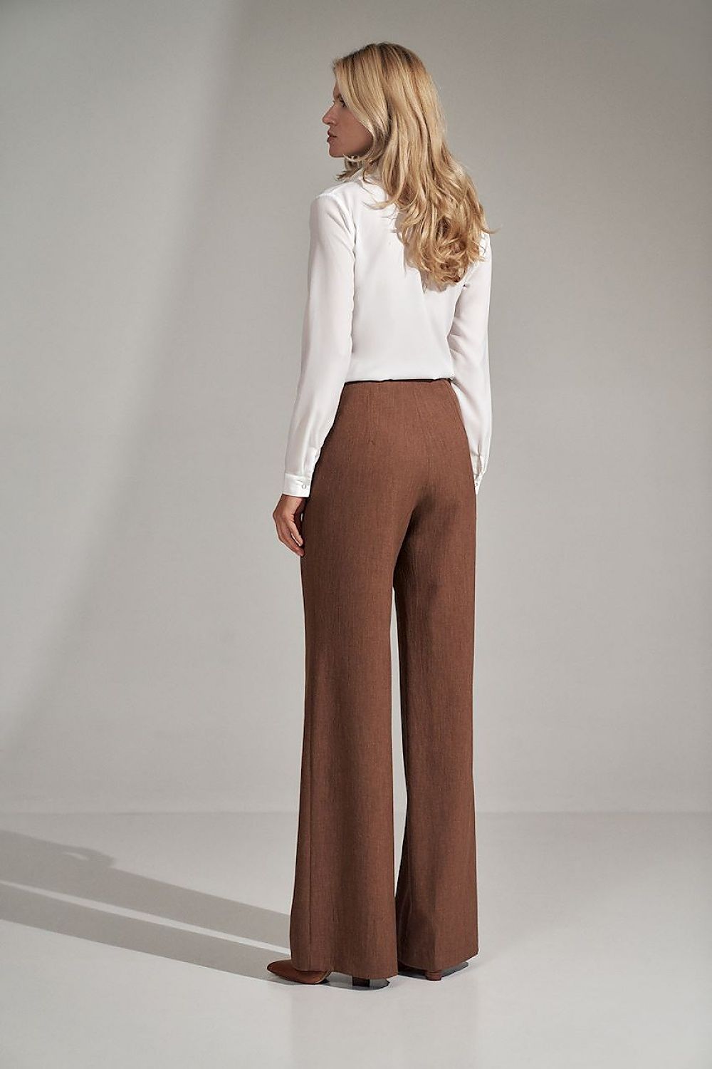 Brown long bell-bottomed trousers